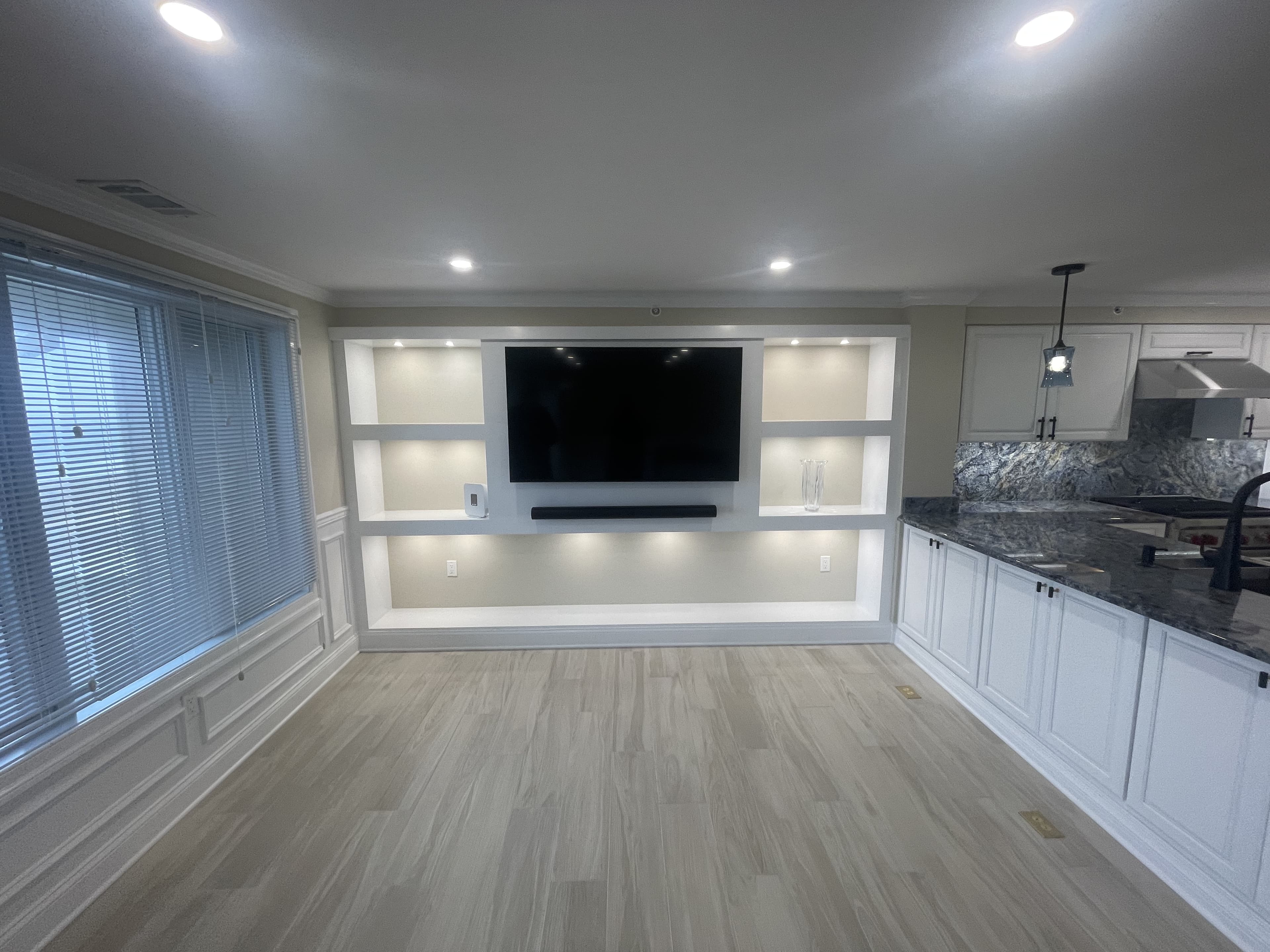 Custom built-in entertainment console with recessed shelving